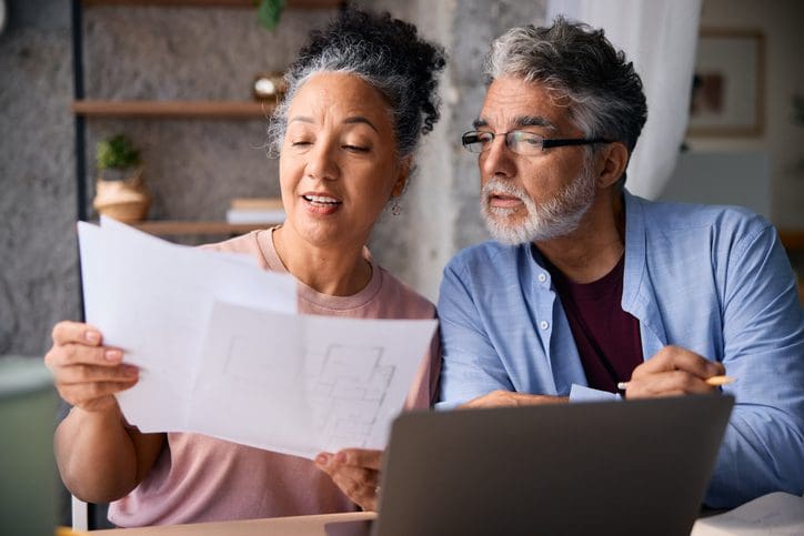 Older couple examining paperwork