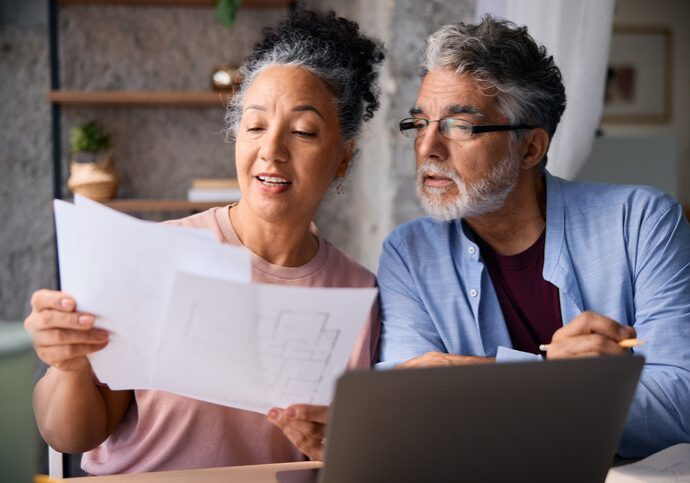 Older couple examining paperwork